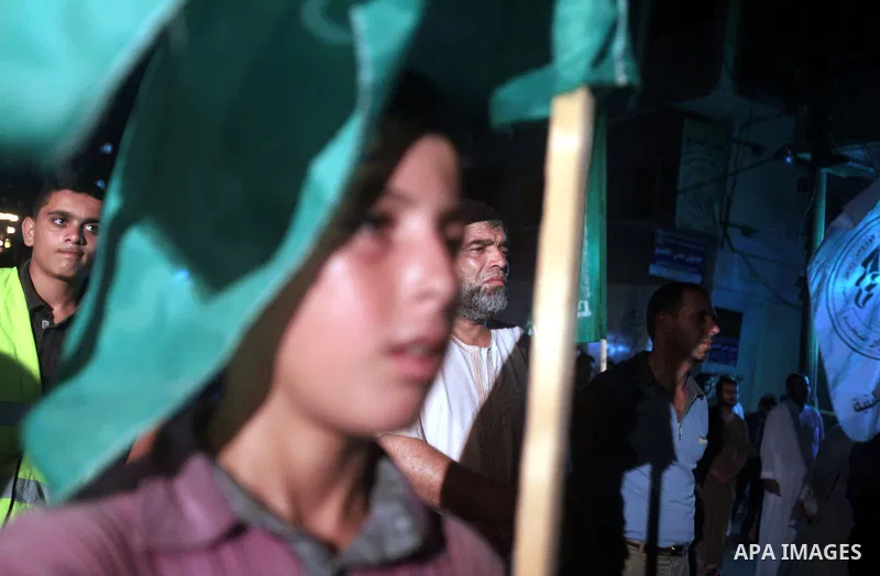 Palestinians Hamas movement supporters hold up banners during a rally in Gaza city, on 18 July 2012. Protesters demand Palestinian President Mahmoud Abbas and Egypt's President Mohamed Morsi to fix electricity crisis in...