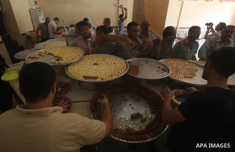 Palestinian vendors distribute sweets after the results of high school exams, or "Tawjihi", in Gaza city on July 19, 2012. Photo by Ashraf Amra