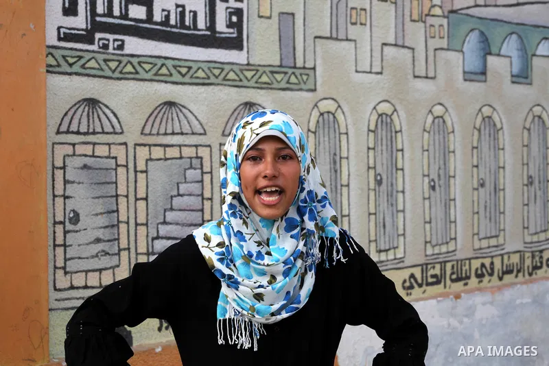 Palestinian secondary school student crying after find their results in Gaza city on July 19, 2012. The Ministry of Education in Gaza Strip and the West Bank announced the results together. Photo by Ashraf Amra