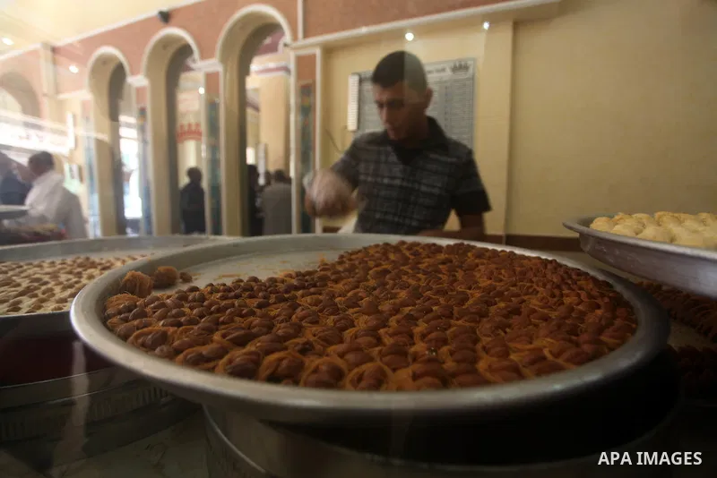 Palestinian vendors sell sweets after the results of high school exams, or "Tawjihi", in Gaza city on July 19, 2012. Photo by Ashraf Amra