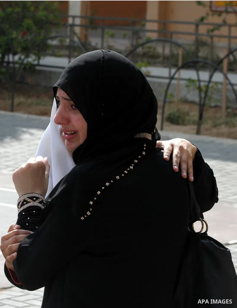 Palestinian secondary school student crying after find their results in Gaza city on July 19, 2012. The Ministry of Education in Gaza Strip and the West Bank announced the results together. Photo by Ashraf Amra