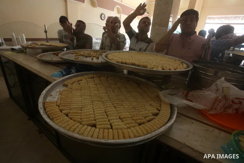 Palestinian vendors sell sweets after the results of high school exams, or "Tawjihi", in Gaza city on July 19, 2012. Photo by Ashraf Amra