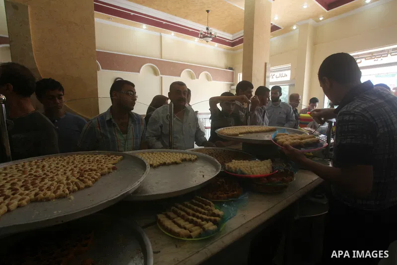 Palestinian vendors sell sweets after the results of high school exams, or "Tawjihi", in Gaza city on July 19, 2012. Photo by Ashraf Amra