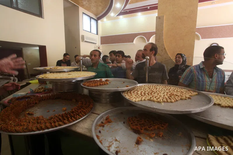 Palestinian vendors sell sweets after the results of high school exams, or "Tawjihi", in Gaza city on July 19, 2012. Photo by Ashraf Amra