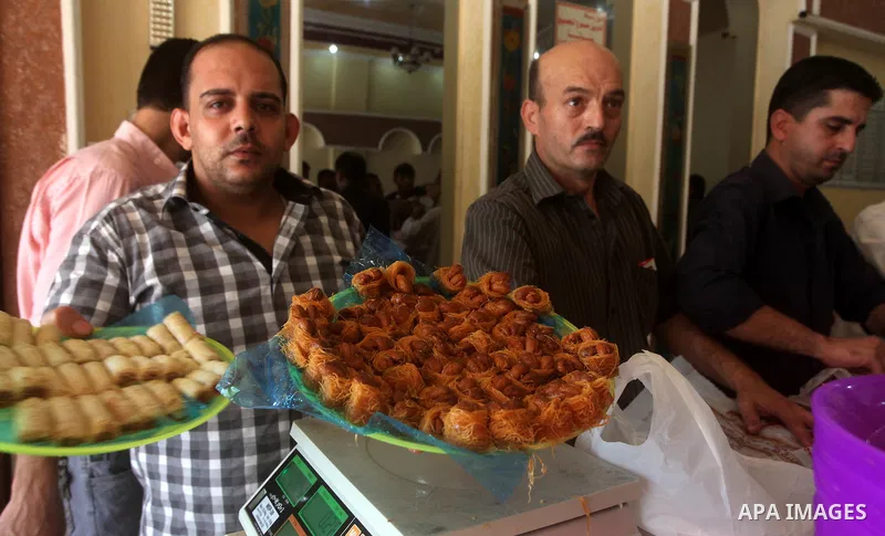 Palestinian vendors sell sweets after the results of high school exams, or "Tawjihi", in Gaza city on July 19, 2012. Photo by Ashraf Amra