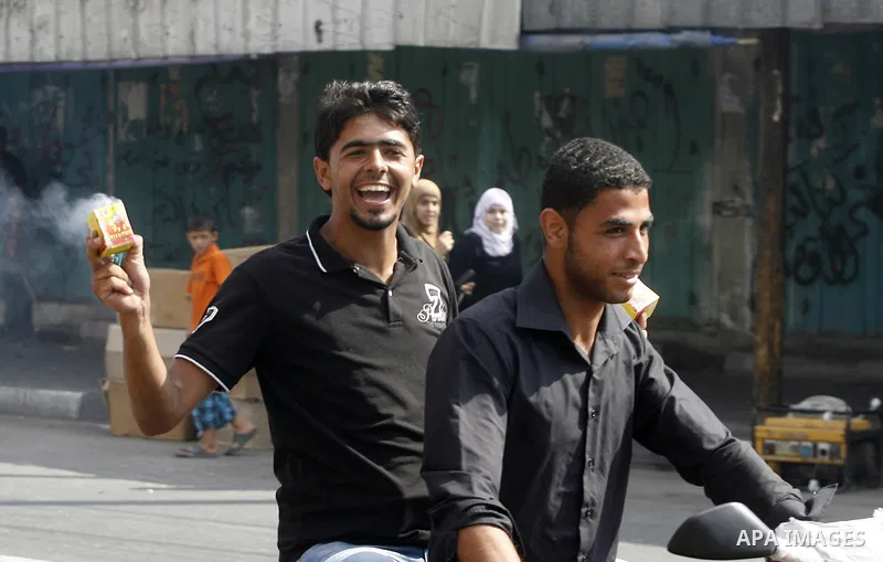 Palestinian secondary school student celebrated after find their results in Rafah in the southern Gaza Strip on July 19, 2012. The Ministry of Education in Gaza Strip and the West Bank announced the results together. Pho...