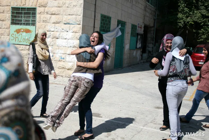 Palestinian high school student celebrated after hearing the results of their final exams known as "Tawjihi" in the West Bank city of Ramallah on July 19, 2012. The Ministry of Education in Gaza Strip and the West Bank a...