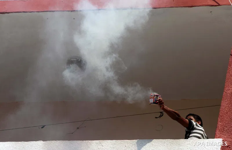 A Palestinian launch fireworks after heard the results of final exams known as "Tawjihi" iin Gaza city, on July 19, 2012. The Ministry of Education in Gaza Strip announced the final results coincide with the West Bank. P...