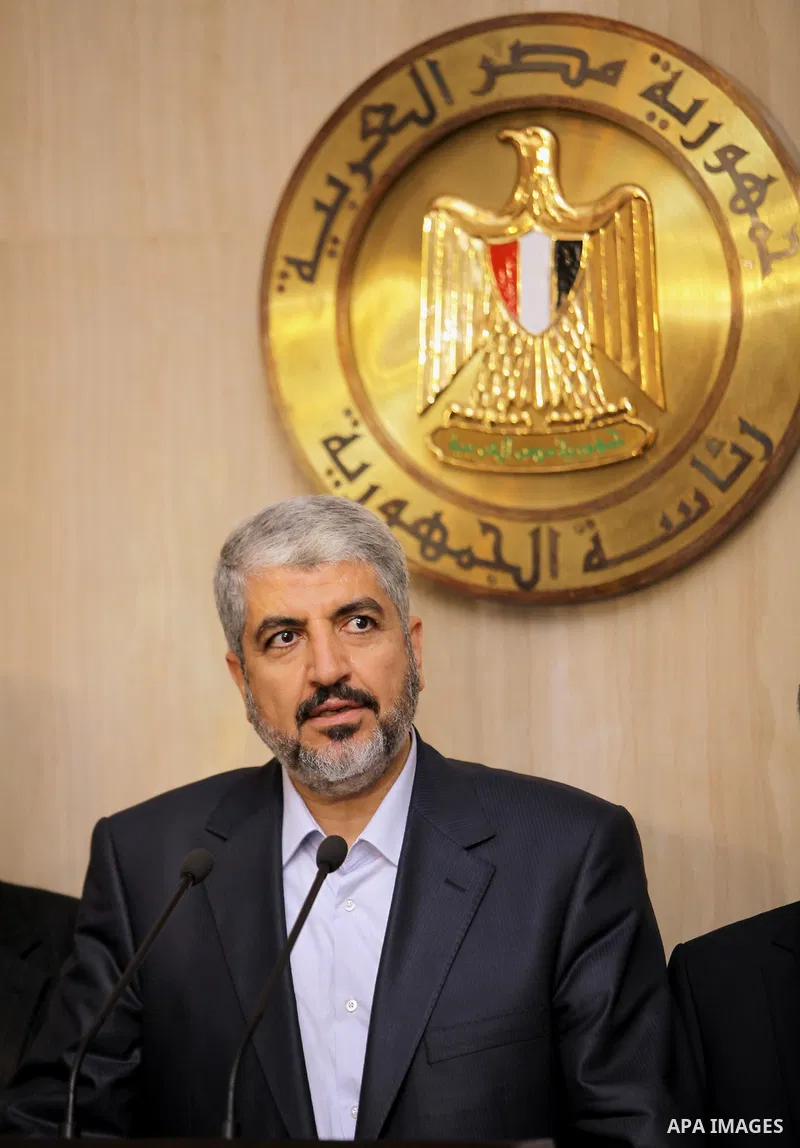 Hamas leader Khaled Meshaal speaks during a news conference with Hamas delegates after their meeting with Egypt's President Mohamed Mursi at the presidential palace in Cairo July 19, 2012. Photo by Mohammed Al-Hams