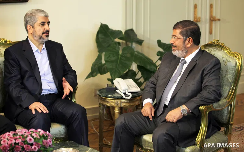 Egypt's president Mohamed Mursi (R) meets with Hamas leader Khaled Meshaal (2nd R) and members of Hamas at the presidential palace in Cairo July 19, 2012. Photo by Mohammed Al-Hams