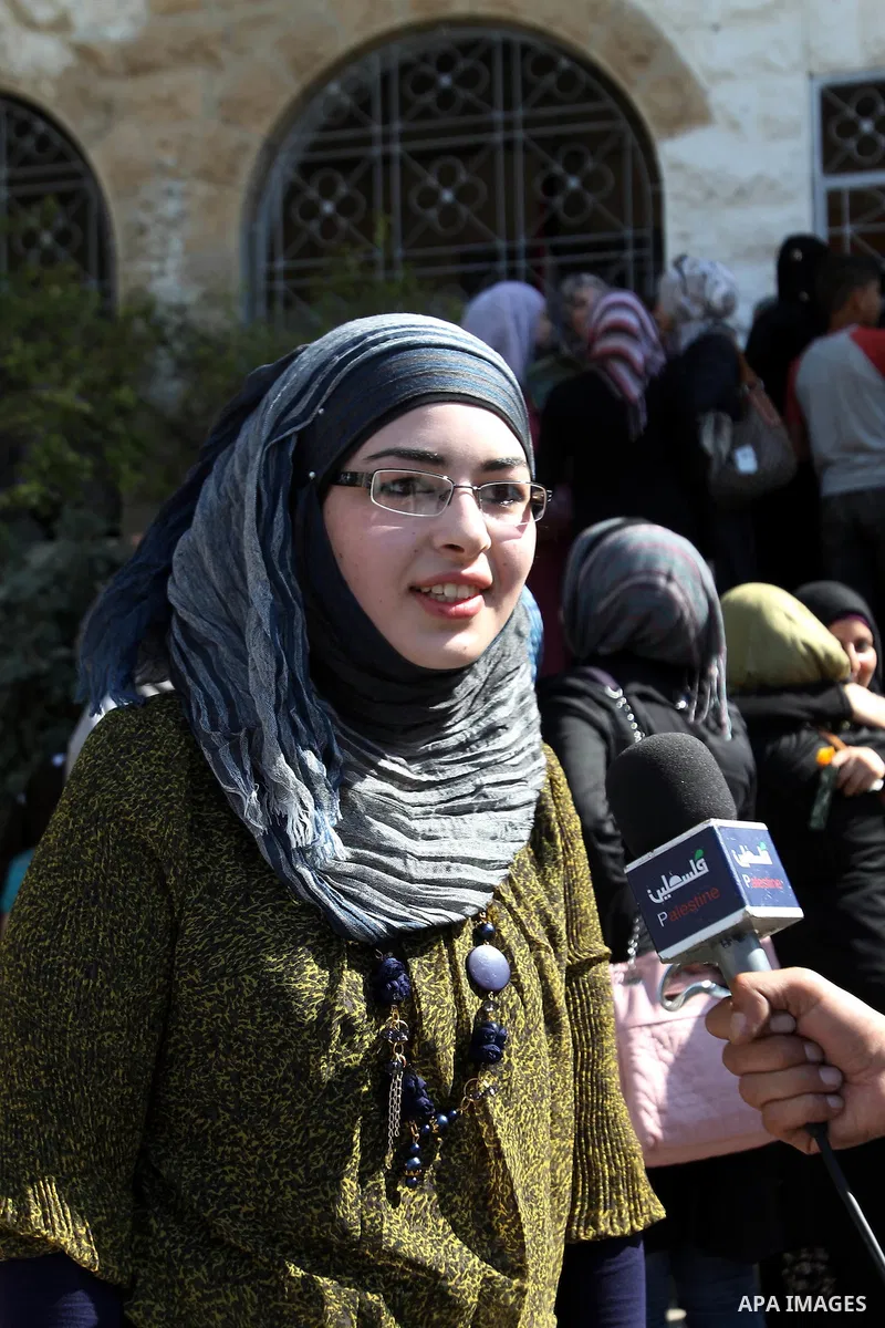 A Palestinian high school student and the first on provinces of Palestine, Sara Shwiki speaks to Press after heard the results of her final exams known as ''Tawjihi'' in the West Bank city of Hebron, on July 19, 2012. Th...