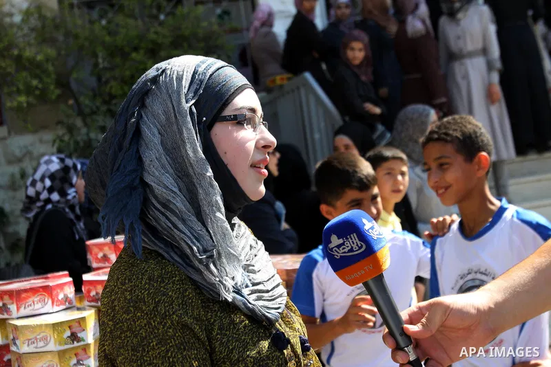 A Palestinian high school student and the first on provinces of Palestine, Sara Shwiki speaks to Press after heard the results of her final exams known as ''Tawjihi'' in the West Bank city of Hebron, on July 19, 2012. Th...