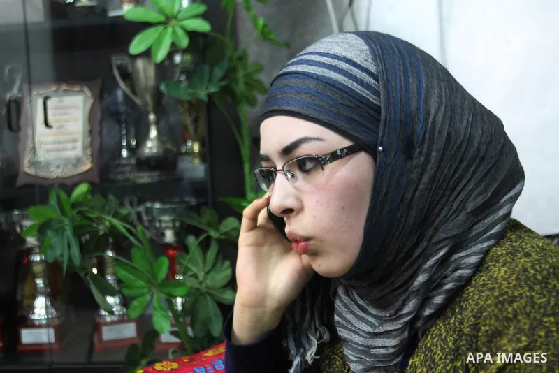 A Palestinian high school student and the first on provinces of Palestine, Sara Shwiki celebrates with her family after heard the results of her final exams known as ''Tawjihi'' in the West Bank city of Hebron, on July 1...