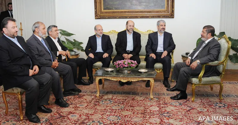 Egypt's president Mohamed Mursi (R) meets with Hamas leader Khaled Meshaal (2nd R) and members of Hamas at the presidential palace in Cairo July 19, 2012. Mohamed Abd Almoaty / Egyptian Presidency