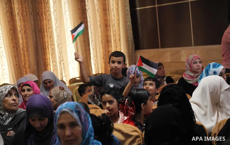 Palestinians attend the ceremony for superior high school students in Gaza city, on 19 July 2012. The Ministry of Education in Gaza Strip announced the final results of high school final exams known as ''Tawjihi'' coinci...