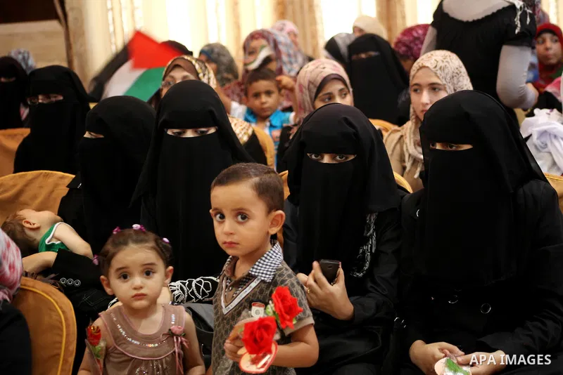 Palestinians attend the ceremony for superior high school students in Gaza city, on 19 July 2012. The Ministry of Education in Gaza Strip announced the final results of high school final exams known as ''Tawjihi'' coinci...
