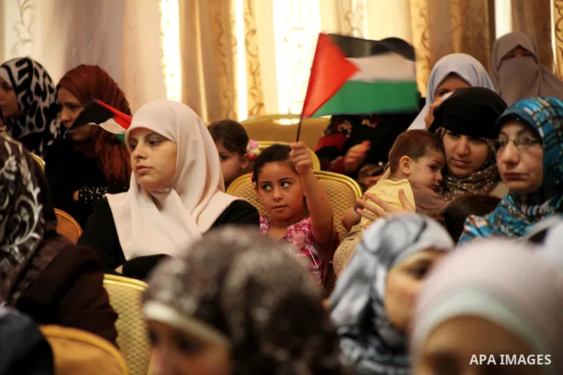 Palestinians attend the ceremony for superior high school students in Gaza city, on 19 July 2012. The Ministry of Education in Gaza Strip announced the final results of high school final exams known as ''Tawjihi'' coinci...