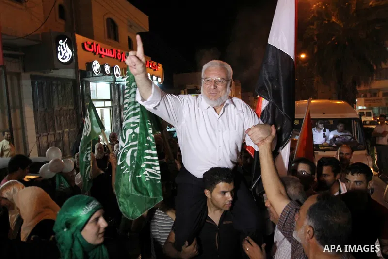 Senior Hamas member Abdel Aziz Dweik celebrates his release near the West Bank city Hebron, Thursday, July 19, 2012. Dweik, 64, was freed Thursday after serving six months in an Israeli jail without charges. Photo by Mam...