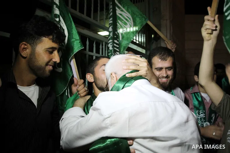 Senior Hamas member Abdel Aziz Dweik celebrates his release near the West Bank city Hebron, Thursday, July 19, 2012. Dweik, 64, was freed Thursday after serving six months in an Israeli jail without charges. Photo by Mam...