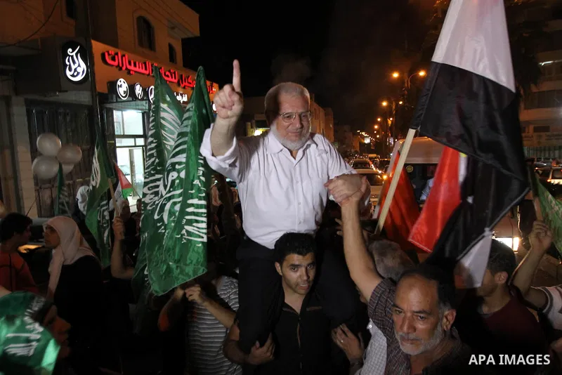 Senior Hamas member Abdel Aziz Dweik celebrates his release near the West Bank city Hebron, Thursday, July 19, 2012. Dweik, 64, was freed Thursday after serving six months in an Israeli jail without charges. Photo by Mam...