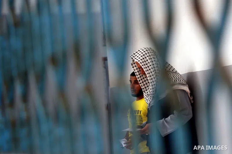 Palestinian prisoners prepare to be freed from a Hamas-run jail in Gaza City on July 21, 2012. Palestinian Hamas police released prisoners because of the approaching holy month of Ramadan. Photo by Momen Faiz