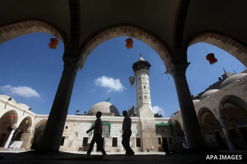Palestinian walks into a mosque in Gaza City on the second day of the month of Ramadan, on 21 July 2012. Muslims around the world refrain from eating, drinking and sexual intercourse from dawn till dusk during Ramadan, t...
