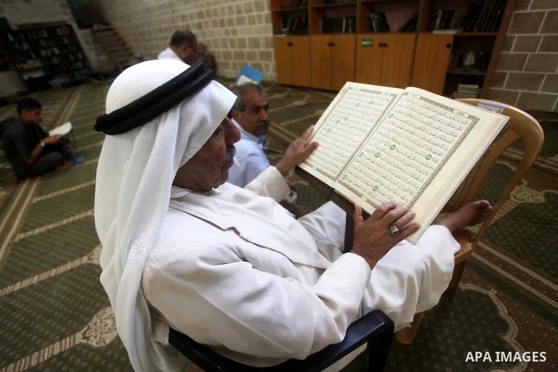 Palestinian muslims read the holy Qur'an at al-Omari mosque in Gaza city, on 21 July 2012. Muslims around the world refrain from eating, drinking and sexual intercourse from dawn till dusk during Ramadan, the holiest mon...