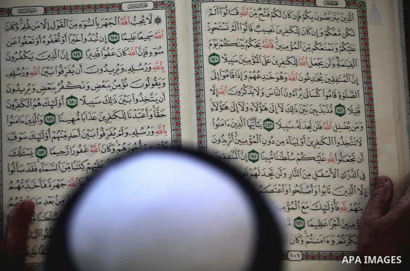 A Palestinian man reads the holy Qur'an at al-Omari mosque in Gaza city, on 21 July 2012. Muslims around the world refrain from eating, drinking and sexual intercourse from dawn till dusk during Ramadan, the holiest mont...