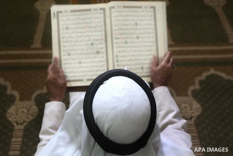 A Palestinian man reads the holy Qur'an at al-Omari mosque in Gaza city, on 21 July 2012. Muslims around the world refrain from eating, drinking and sexual intercourse from dawn till dusk during Ramadan, the holiest mont...