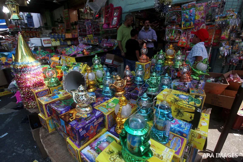 A Palestinian vendor displays goods in front of his shop in Gaza city on the second day of the holy month of Ramadan, on 21 July 2012. Muslims around the world abstain from eating, drinking and conducting sexual relation...
