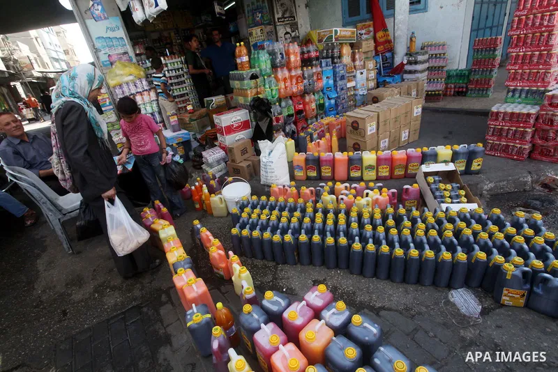 Palestinians shop at the traditional market in Gaza city on the second day of the holy month of Ramadan,on 21 July 2012. Muslims around the world abstain from eating, drinking and conducting sexual relations from dawn ti...