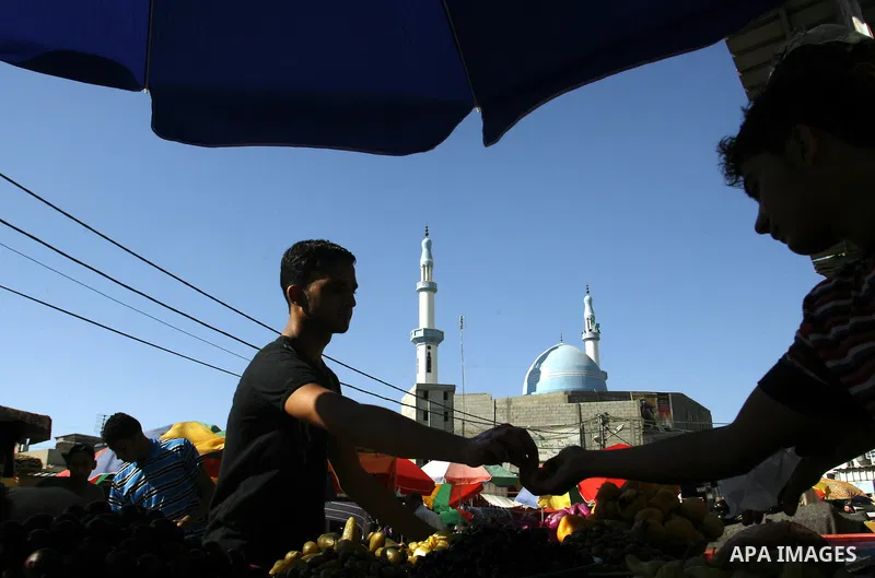 A Palestinian vendor sells pickles at a market on the second day of the holy month of Ramadan, at a shop in Rafah in south of Gaza Strip, on 21 July 2012. Muslims around the world abstain from eating, drinking and conduc...