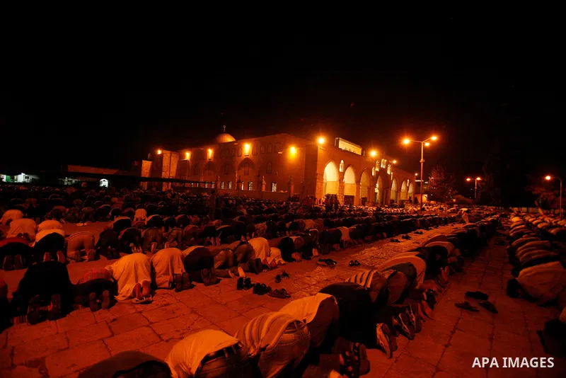 Palestinian worshippers attend night prayer at al-Aqsa Mosque in Jerusalem's Old City on the second day of the holy month of Ramadan, on 21 July 2012. Muslims around the world abstain from eating, drinking and conducting...
