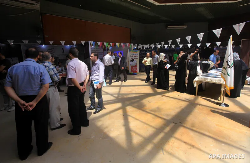 Palestinian students participate in the exhibition for Palestine colleges in the Rashad Shawa Center in Gaza City, on July 22, 2012.. Photo by Majdi Fathi