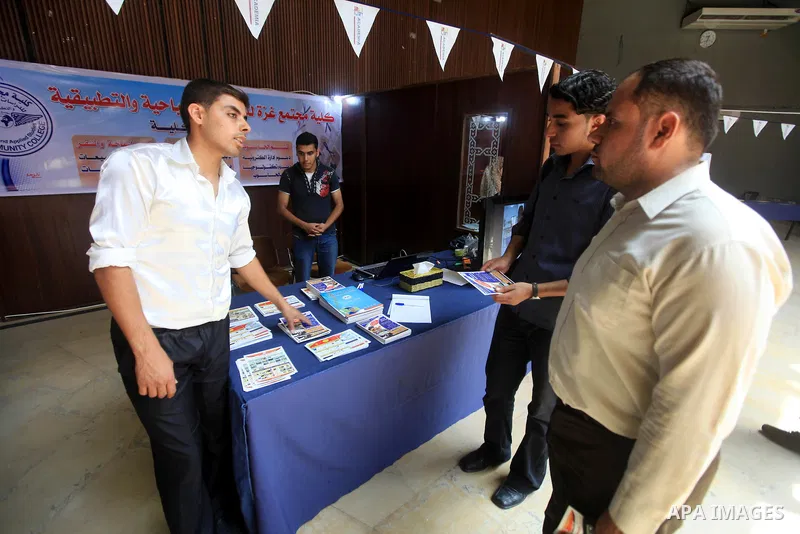 Palestinian students participate in the exhibition for Palestine colleges in the Rashad Shawa Center in Gaza City, on July 22, 2012.. Photo by Majdi Fathi
