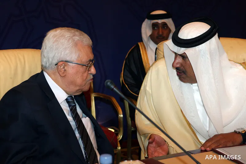 Palestinian President Mahmoud Abbas (Abu Mazen) talks to Qatar's Sheikh Hamad bin Jassim bin al Thani, during Arab Monitoring Committee meeting, in Doha, on July 22, 2012. Photo by Thaer Ganaim