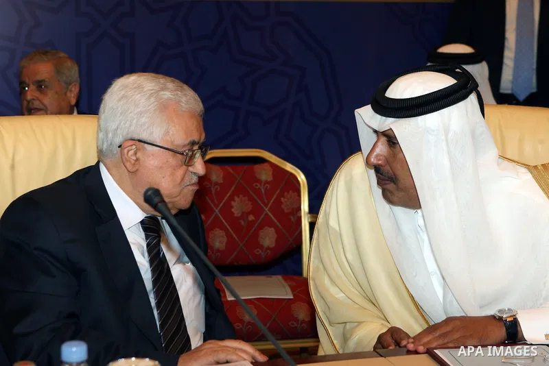 Palestinian President Mahmoud Abbas (Abu Mazen) talks to Qatar's Sheikh Hamad bin Jassim bin al Thani, during Arab Monitoring Committee meeting, in Doha, on July 22, 2012. Photo by Thaer Ganaim