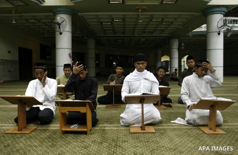 Delegation of the Indonesian read the holy Qur'an at al- Abrar mosque in Rafah in southern Gaza strip, on 22 July 2012. Muslims around the world refrain from eating, drinking and sexual intercourse from dawn till dusk du...