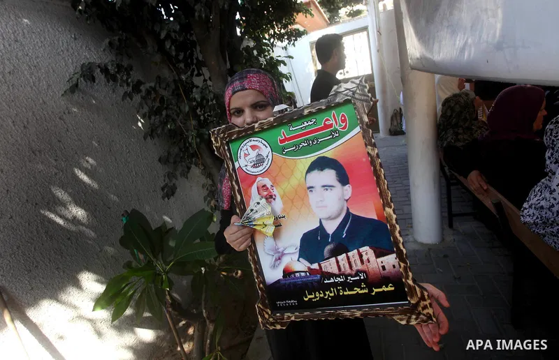Palestinian relatives prisoners attend a protest calling for the release of their sons held in Israeli jails in front of the headquarters Red Cross in Gaza City, Gaza Strip, on July.23, 2012. Photo by Ashraf Amra