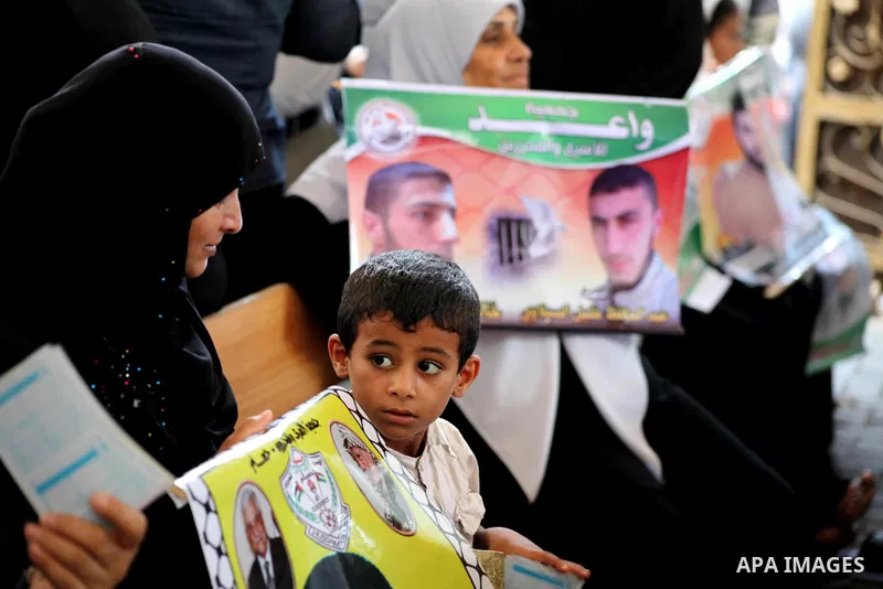 Palestinian relatives prisoners attend a protest calling for the release of their sons held in Israeli jails in front of the headquarters Red Cross in Gaza City, Gaza Strip, on July.23, 2012. Photo by Ashraf Amra