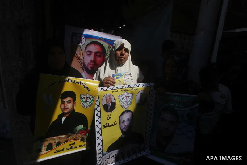 Palestinian relatives prisoners attend a protest calling for the release of their sons held in Israeli jails in front of the headquarters Red Cross in Gaza City, Gaza Strip, on July.23, 2012. Photo by Ashraf Amra
