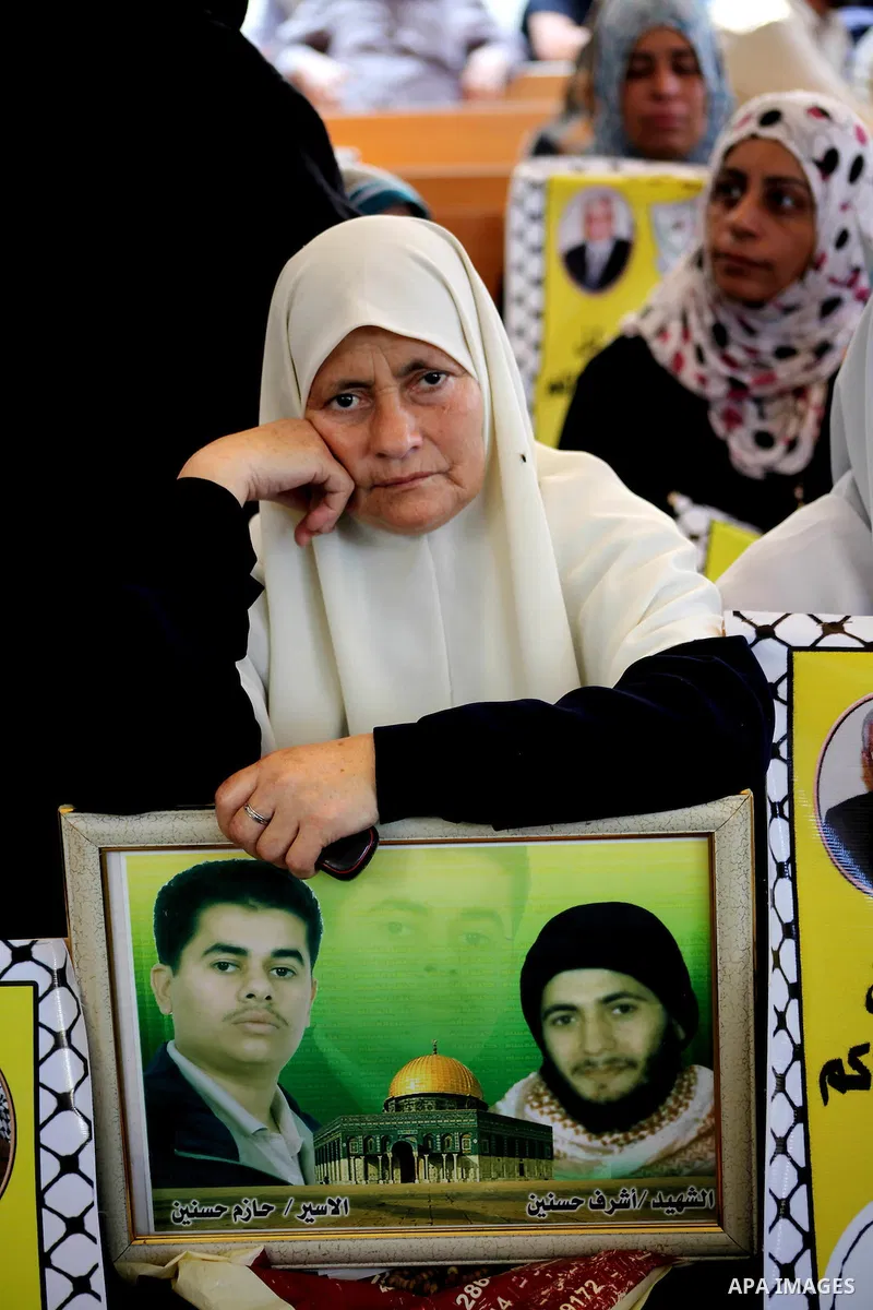 Palestinian relatives prisoners attend a protest calling for the release of their sons held in Israeli jails in front of the headquarters Red Cross in Gaza City, Gaza Strip, on July.23, 2012. Photo by Ashraf Amra