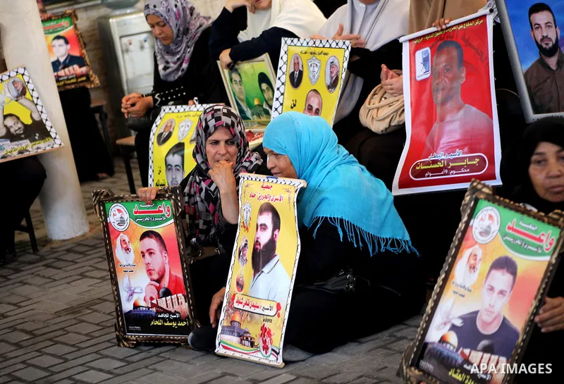 Palestinian relatives prisoners attend a protest calling for the release of their sons held in Israeli jails in front of the headquarters Red Cross in Gaza City, Gaza Strip, on July.23, 2012. Photo by Ashraf Amra