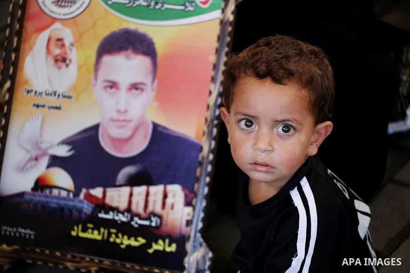 Palestinian relatives prisoners attend a protest calling for the release of their sons held in Israeli jails in front of the headquarters Red Cross in Gaza City, Gaza Strip, on July.23, 2012. Photo by Ashraf Amra