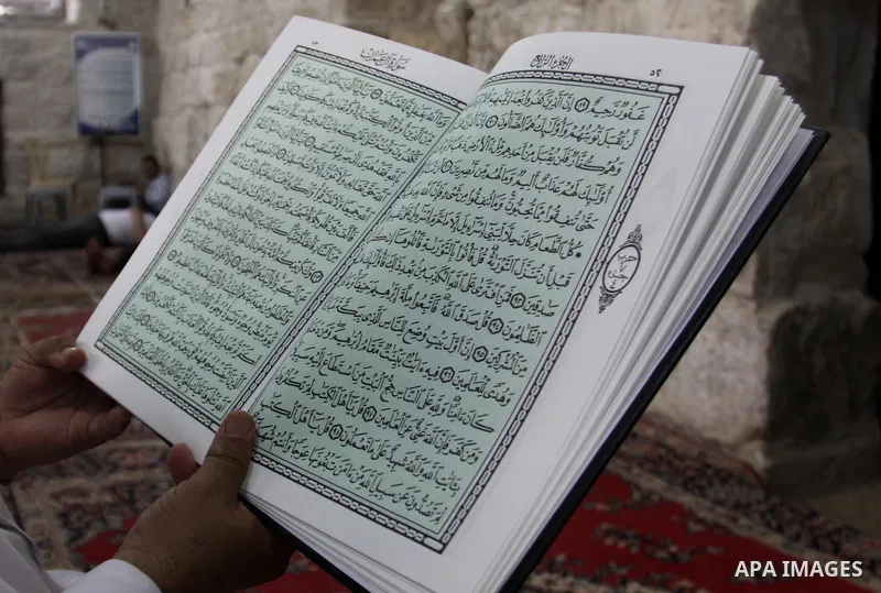 Palestinians read the holy Qur'an at the mosque in West Bank City of Nablus, on 23 July 2012. Muslims around the world refrain from eating, drinking and sexual intercourse from dawn till dusk during Ramadan, the holiest...