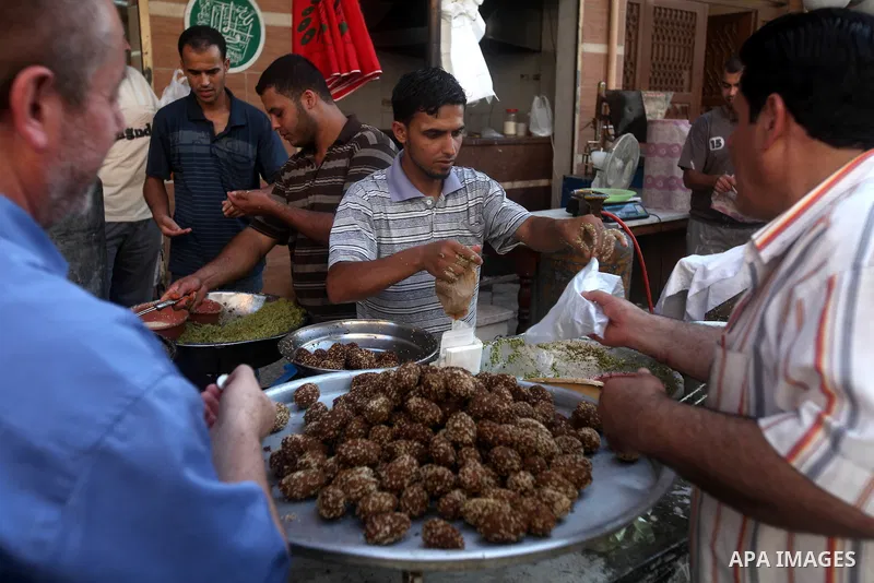 A Palestinian man prepares traditional Falafel during Ramadan in Gaza city, on July 23, 2012. Muslims around the world abstain from eating, drinking and conducting sexual relations from dawn till dusk during Ramadan, the...