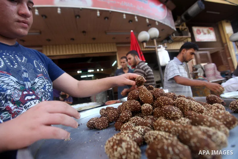 A Palestinian man prepares traditional Falafel during Ramadan in Gaza city, on July 23, 2012. Muslims around the world abstain from eating, drinking and conducting sexual relations from dawn till dusk during Ramadan, the...