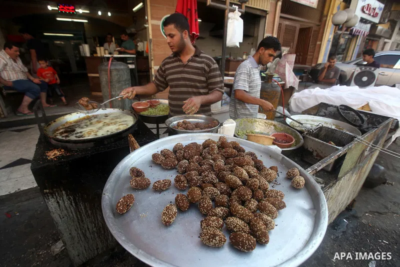 A Palestinian man prepares traditional Falafel during Ramadan in Gaza city, on July 23, 2012. Muslims around the world abstain from eating, drinking and conducting sexual relations from dawn till dusk during Ramadan, the...