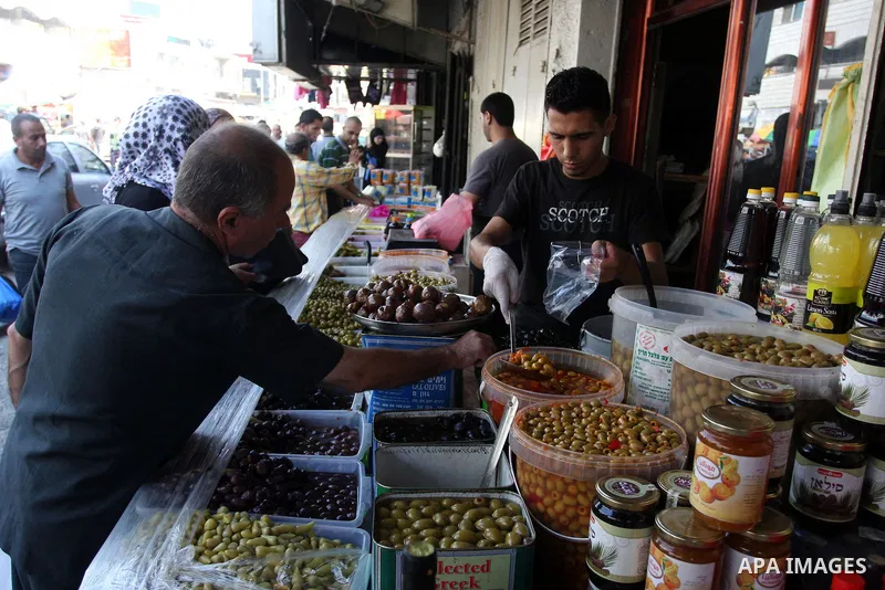 A Palestinian vendor sells pickles during the fasting month of Ramadan in the West Bank city of Ramallah, on July 23, 2012. Muslims around the world abstain from eating, drinking and conducting sexual relations from dawn...