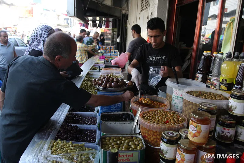 A Palestinian vendor sells pickles during the fasting month of Ramadan in the West Bank city of Ramallah, on July 23, 2012. Muslims around the world abstain from eating, drinking and conducting sexual relations from dawn...